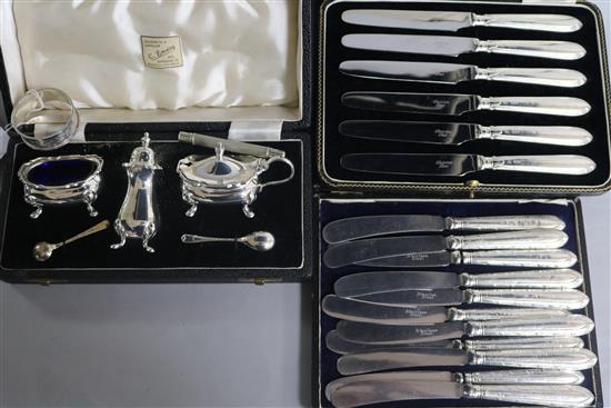 Three cased sets including silver handles knives and a silver napkin ring.